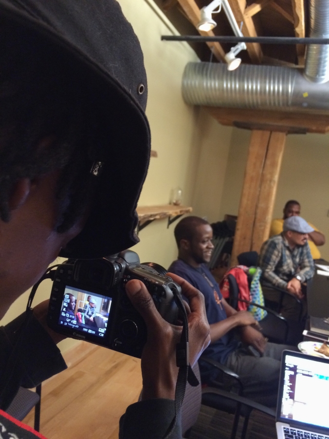 Taye, an artist and organizer with Spirit House, photographs the first participatory defense meeting in Durham! 